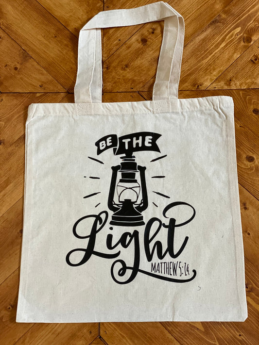 Be the Light Tote bags