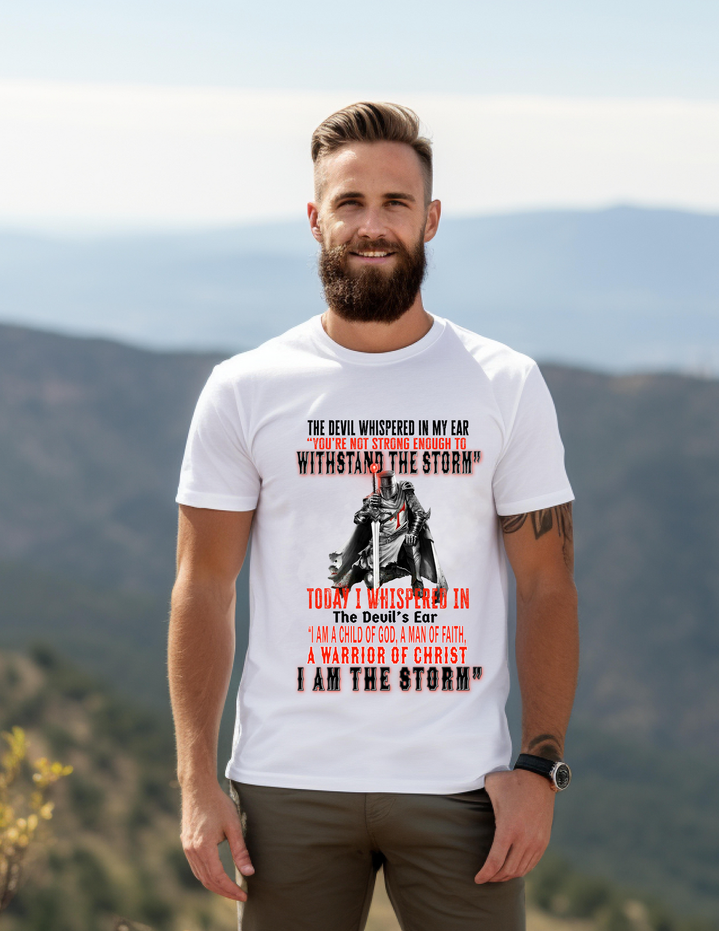 The devil whispered in my ear "you're not strong enough to withstand the storm" Today I whispered in the devil's ear 'I am a child of God, a man of faith, a warrior of christ, I am the STORM" tshirt